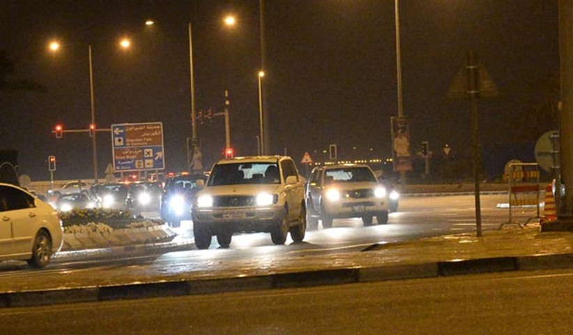 Traffic moves slowly on a Doha street due to the rain