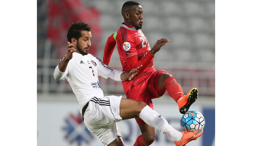 UAE Al-Jazira\'s Ismail Mohamad (L) fights for the ball with Qatar Lekhwiya\'s Mohamed Musa