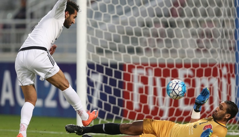 UAE\'s Al-Jazira goalkeeper Amine Lecomte tries to block the ball