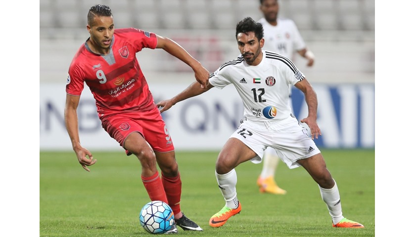 UAE Al-Jazira\'s Salim Rashid (R) fights for the ball with Qatar Lekhwiya\'s Youssef Al-Arabi