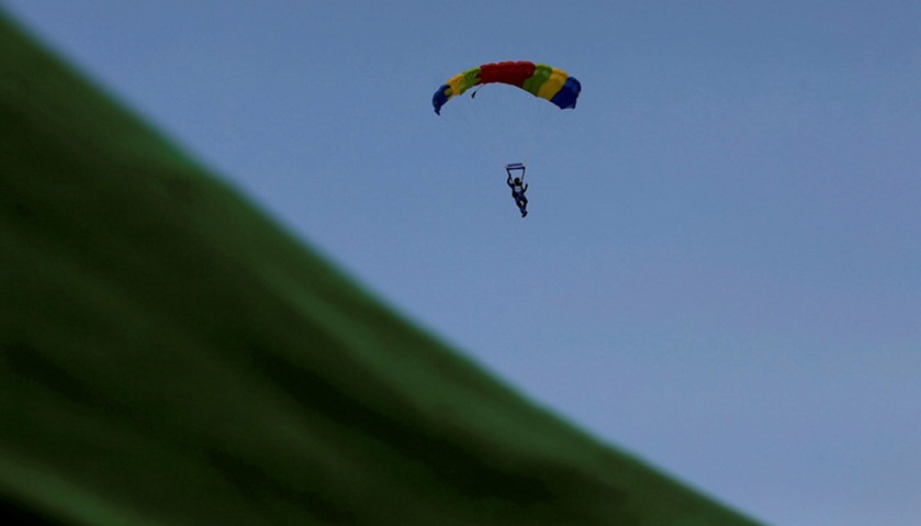 A paratrooper from the Sri Lankan military parachutes down during Independence day celebrations
