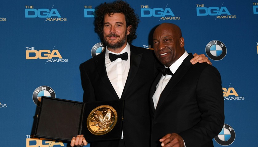 Garth Davis (L) poses with the award for Best Director in a First Time Feature Film for “Lion,\" and 