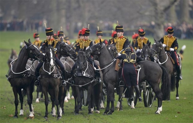 Horsemen prepare to leave after a royal gun salute to mark the start of Sapphire Jubilee year