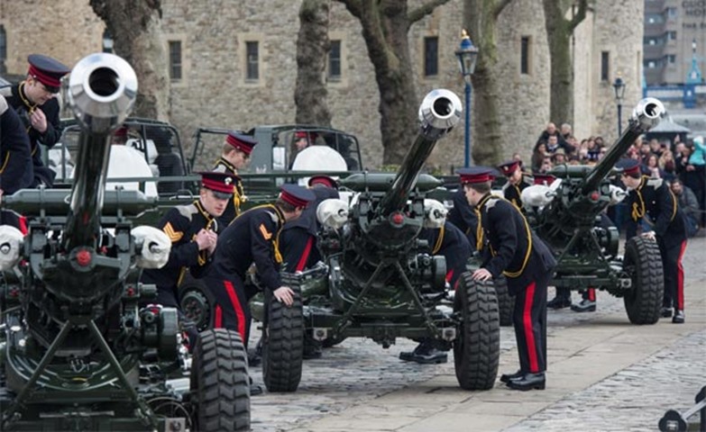 Members of the Honourable Artillery Company prepare their guns to fire a 62-round royal gun salute