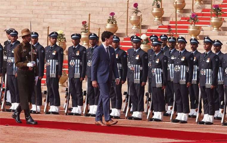 Justin Trudeau inspects an honour guard during his ceremonial reception in New Delhi on Friday