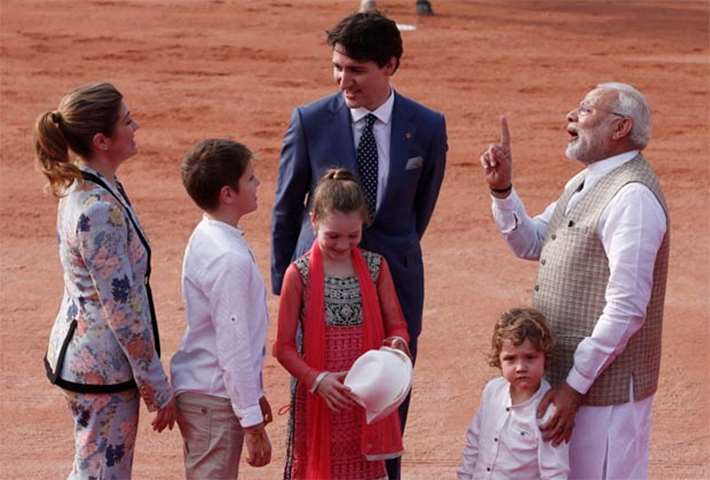 Modi gestures as Trudeau, his wife Sophie Gregoire and children look on during a reception