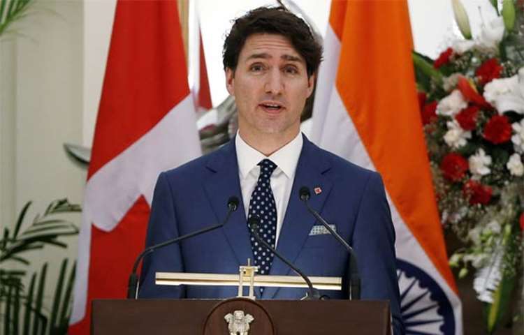 Justin Trudeau reads a joint statement in New Delhi on Friday