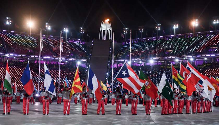 Athletes hold up their national flags during the closing ceremony of the Pyeongchang 2018 Winter Oly