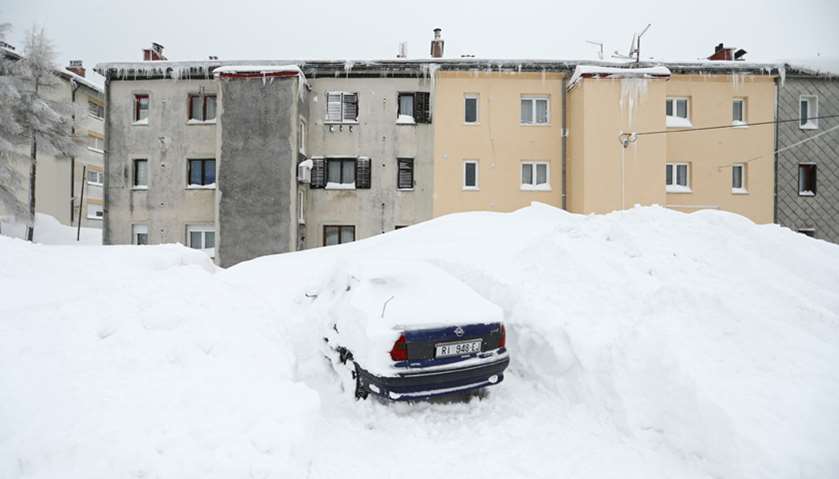 A car covered with snow is seen in Delnice, Croatia