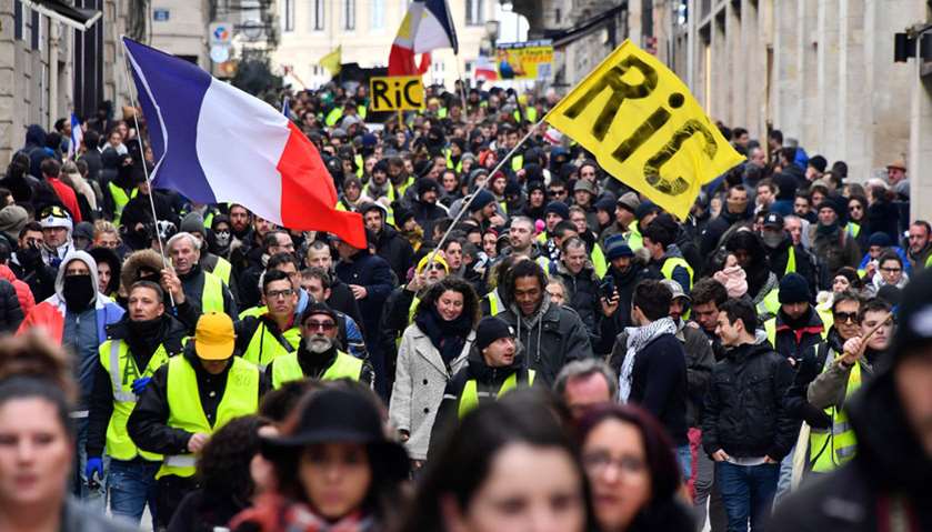 Protestors march as they take part in an anti-government demonstration called by the \'Yellow Vests\' 