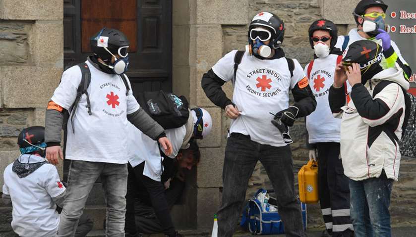 A protester is assisted by street medics during an anti-government demonstration called by the \"Yell