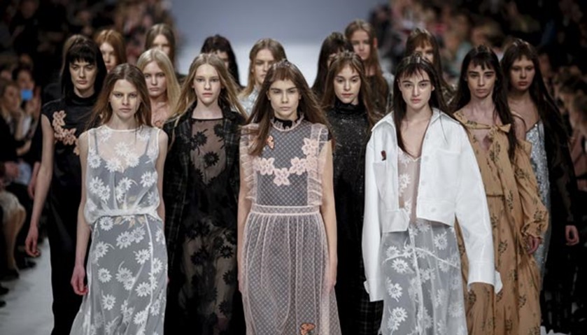 Models present creations by Ukrainian designer Lilia Poustovit
