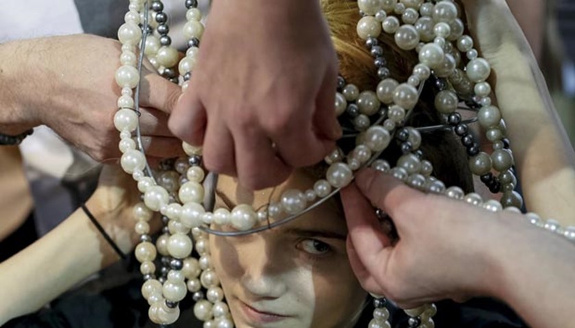 A model has her makeup applied backstage at Ukrainian Fashion Week