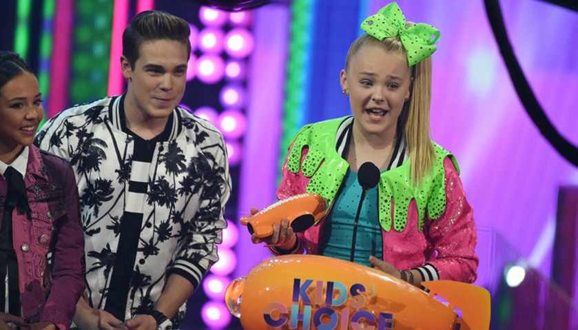 Singer JoJo Siwa accepts the award for Favorite Viral Music Artist on stage