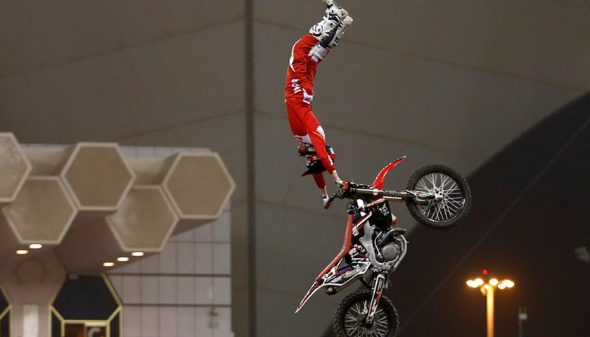 A motorcyclist performs during Monster Jam show