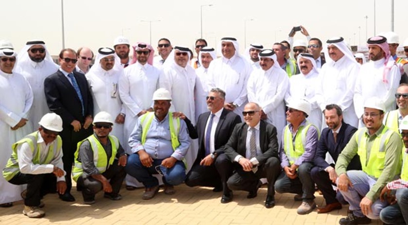 Ministers and dignitaries are seen with officials at the opening of the first phase of the project