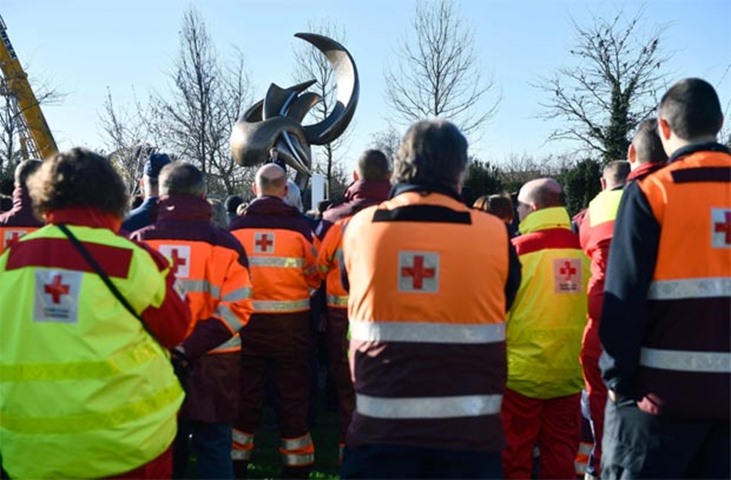 Rescue services workers attend an unveiling ceremony of an art piece called \'Flight in Mind\'