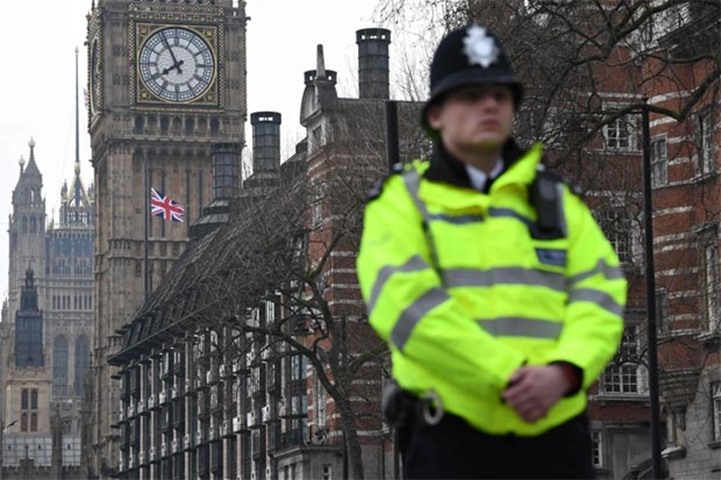 Union flags fly at half-mast in London on Thursday as police maintain a security cordon