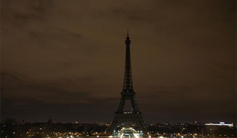 The lights of the Eiffel Tower are switched off at midnight in solidarity with the city of London