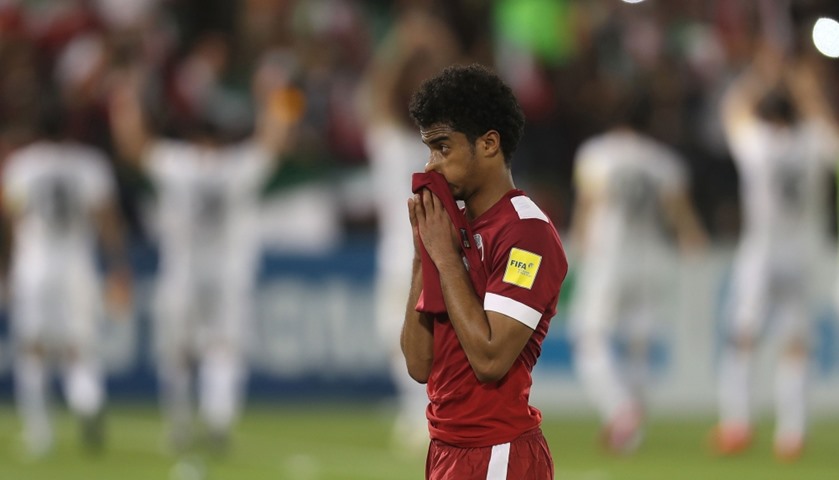 Qatar\'s Akram Hassan Afif reacts after losing 

