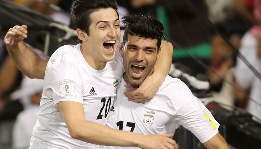 Iran\'s Mehdi Taremi (R) celebrates with his teammate Sardar Azmoun after scoring a goal 
