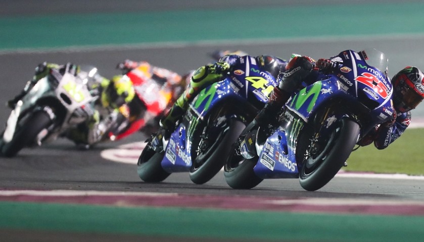 Movistar Yamaha MotoGP\'s Spanish rider Maverick Vinales (R) and Italian Valentino Rossi (C) compete