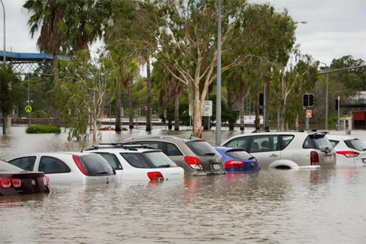 Submerged cars are seen at the flooded Beenleigh train station car park on Friday