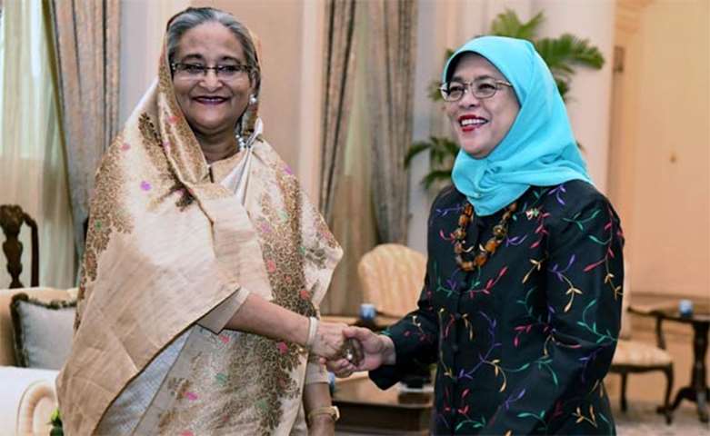 Sheikh Hasina shakes hands with Singapore President Halimah Yacob at the Istana presidential palace