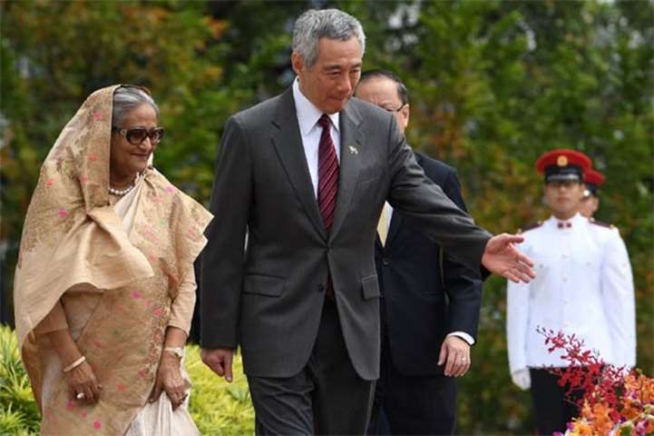 Sheikh Hasina attends a welcoming ceremony with Lee Hsien Loong at the Istana presidential palace