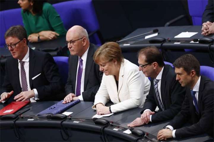 German Chancellor Angela Merkel reacts after being re-elected on Wednesday