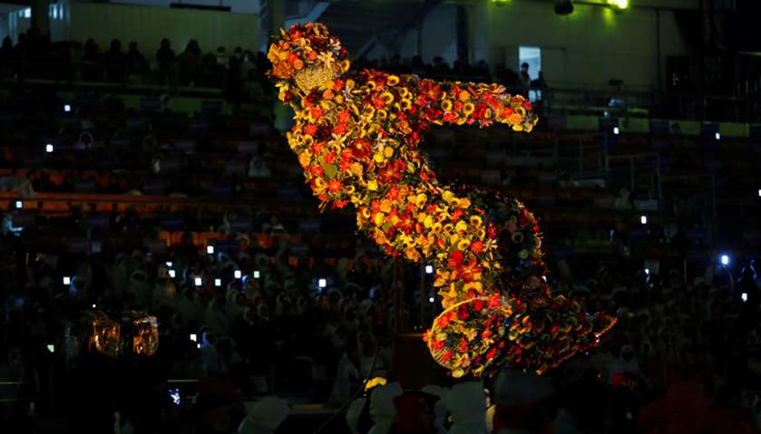 The flower sculpture of snowboarder is seen during the closing ceremony.