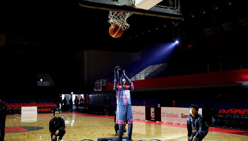 A basketball-playing robot called CUE, developed by Toyota engineers, shoots a free throw during a r