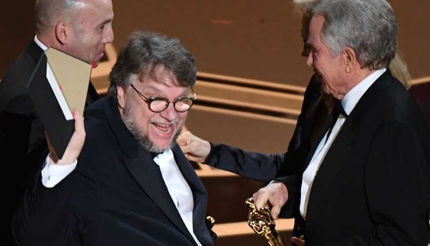 Director Guillermo del Toro (2ndL) accepts the Oscar for Best Film for \"The Shape of Water\"