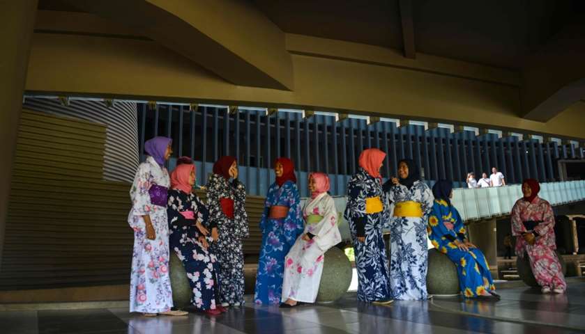 Indonesian students dressed in kimonos take part in the tsunami disaster remembrance event