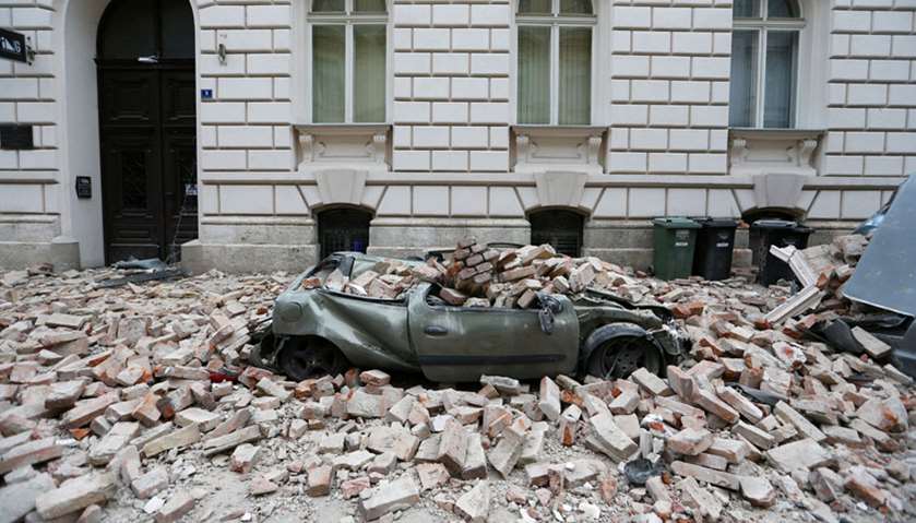 A destroyed car is seen following an earthquake, in Zagreb, Croatia