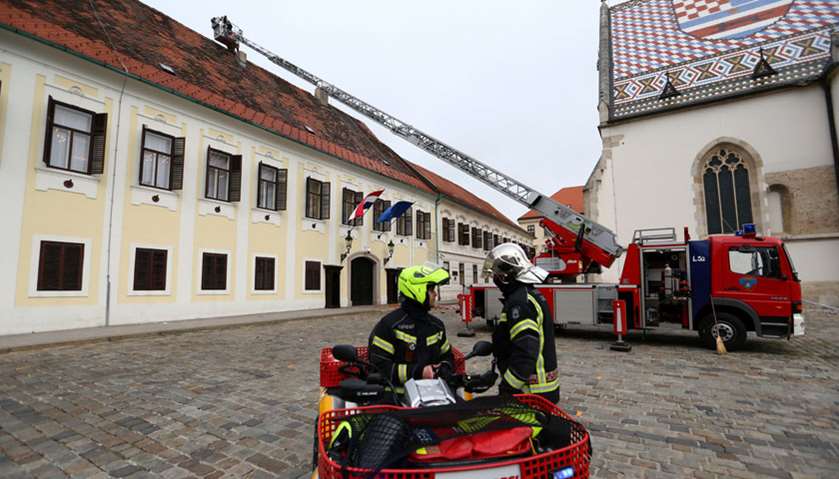 Firefighters are seen in front of the government building following an earthquake, in Zagreb, Croati