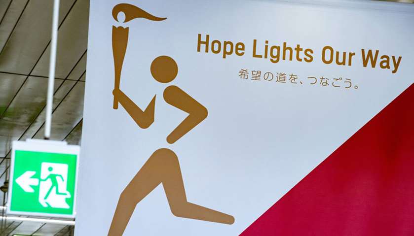 A poster for the Tokyo 2020 torch relay (R) is pictured inside Fukushima railway station in Fukushim
