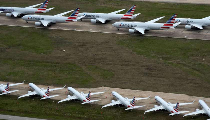 American Airlines passenger planes crowd a runway where they are parked due to flight reductions mad