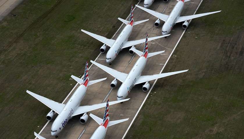 American Airlines passenger planes crowd a runway where they are parked due to flight reductions mad