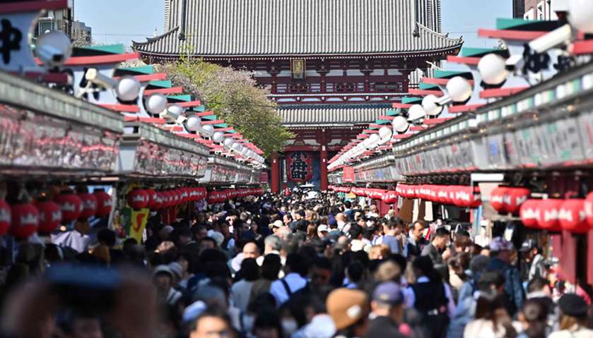 People visiting Sensoji temple in Tokyo\'s Asakusa district