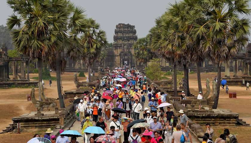 Tourists visiting Angkor Wat temple in Siem Reap province