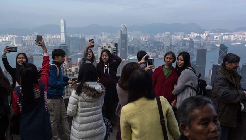 Tourists taking pictures at the Peak in Hong Kong