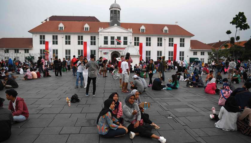 Tourists gathering outside the Jakarta History Museum in the Kota Tua area of Jakarta