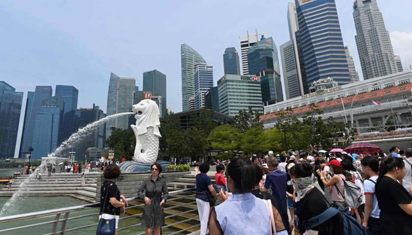 Visitors at the Merlion park in Singapore