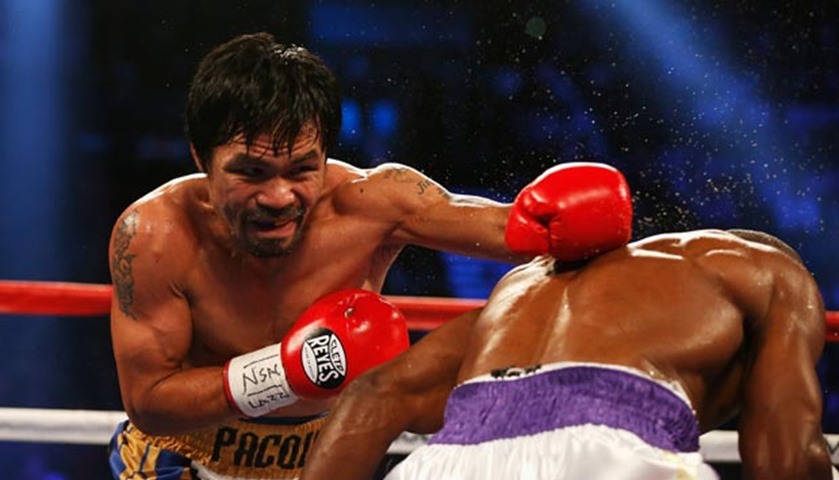 Manny Pacquiao throws a left against Timothy Bradley