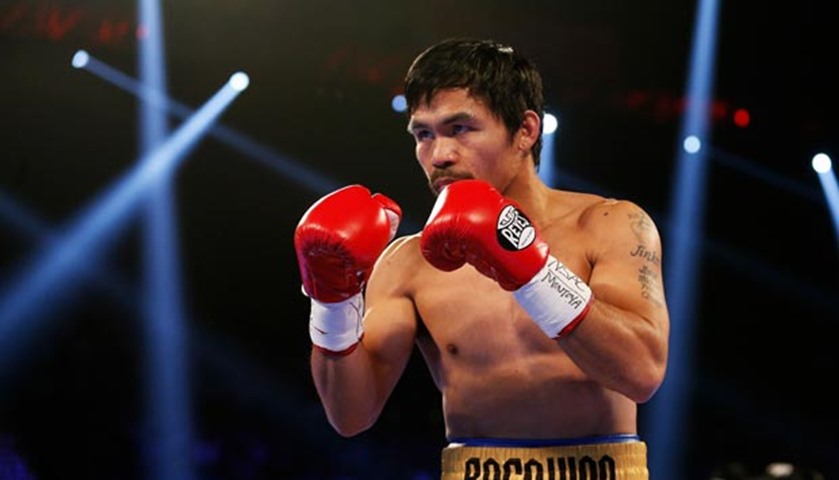 Manny Pacquiao looks to strike Timothy Bradley during their welterweight championship fight