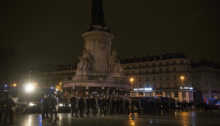 French gendarmes form a line at the Place de la République following violent protest