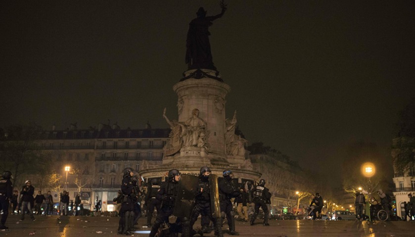French gendarme secure the area at the Place de la République as they face protests