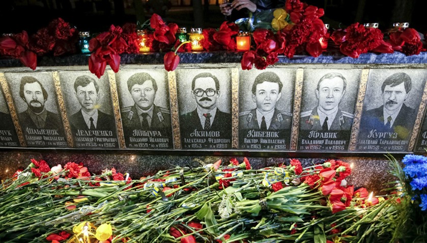Flowers are laid in front of a memorial, dedicated to people who died after the Chernobyl nuclear di