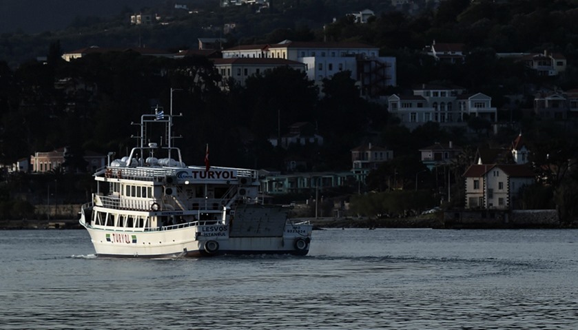 A small Turkish ferry carries migrants who are deported to Turkey